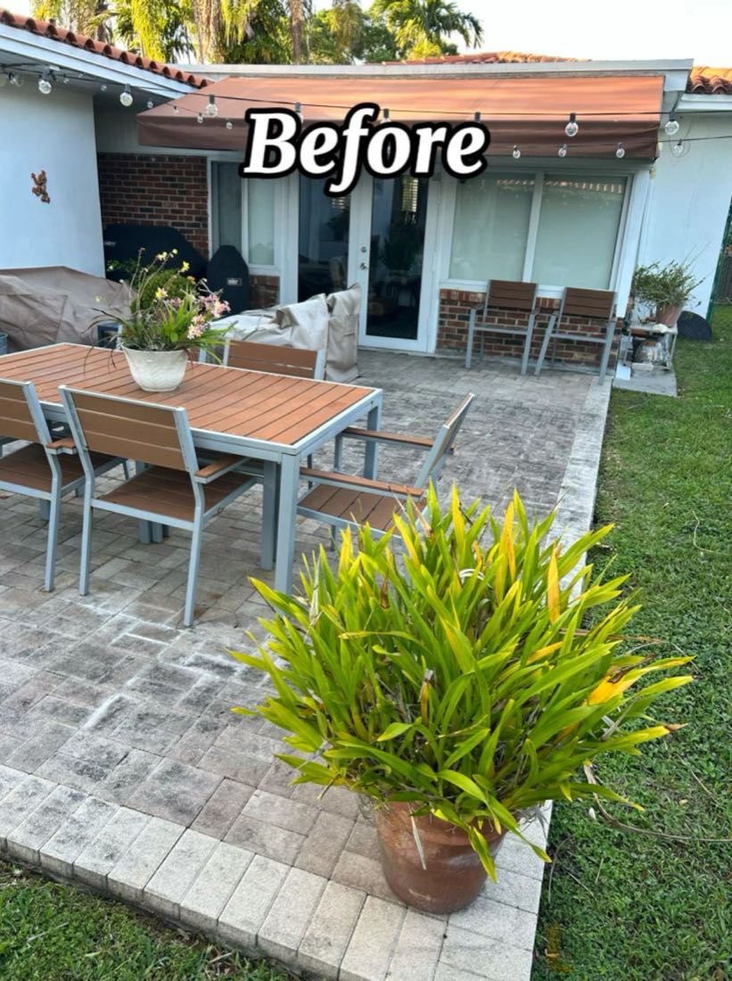 Before: a backyard paver patio covered in grey grime
