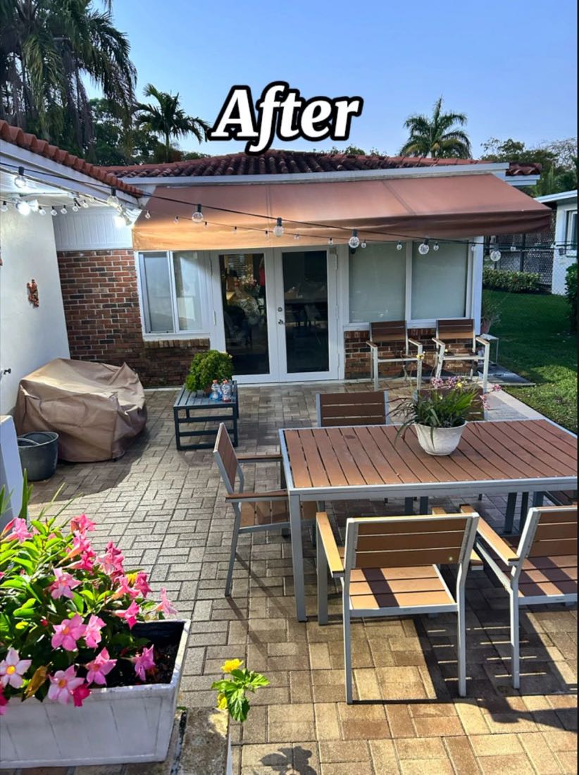 A clean paver patio with an outdoor dining set, after pressure washing